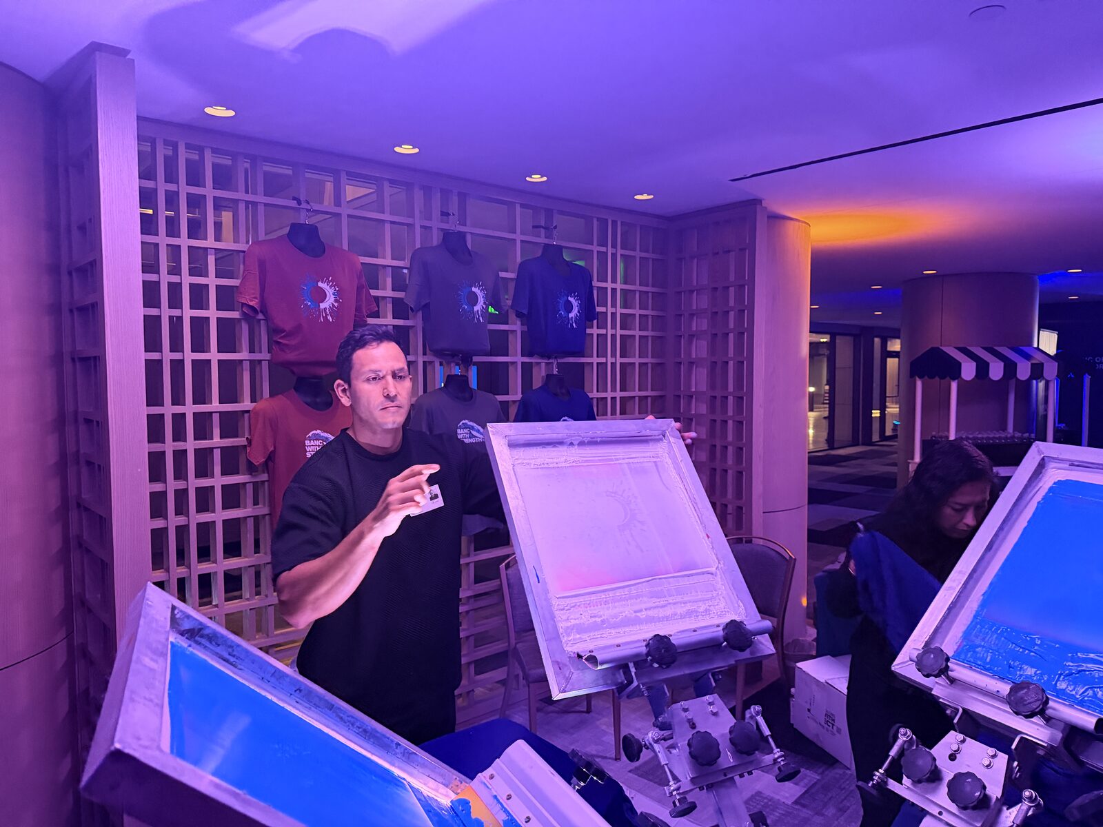 Presses glowing at a night-time event activation